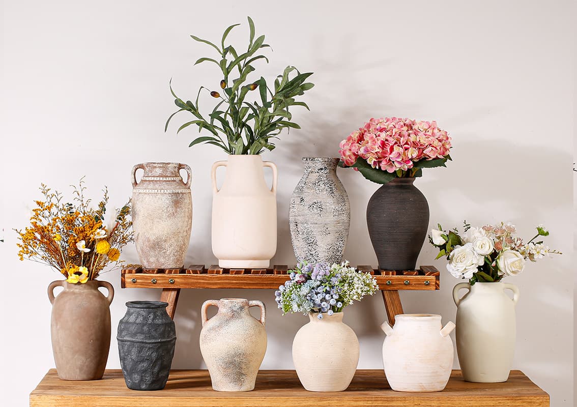 Pastoral textured ceramic vase collection arranged on a wood shelf